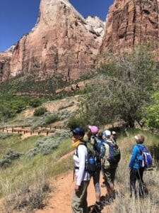 Zion National Park’s Best End-of-Year Hikes 1 a group of Adventure Women hiking in Zion National Park