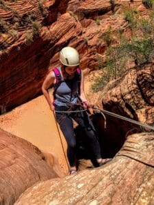 a person canyoneering