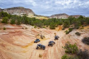 A group of UTVs dricing in the cliffs of East Zion