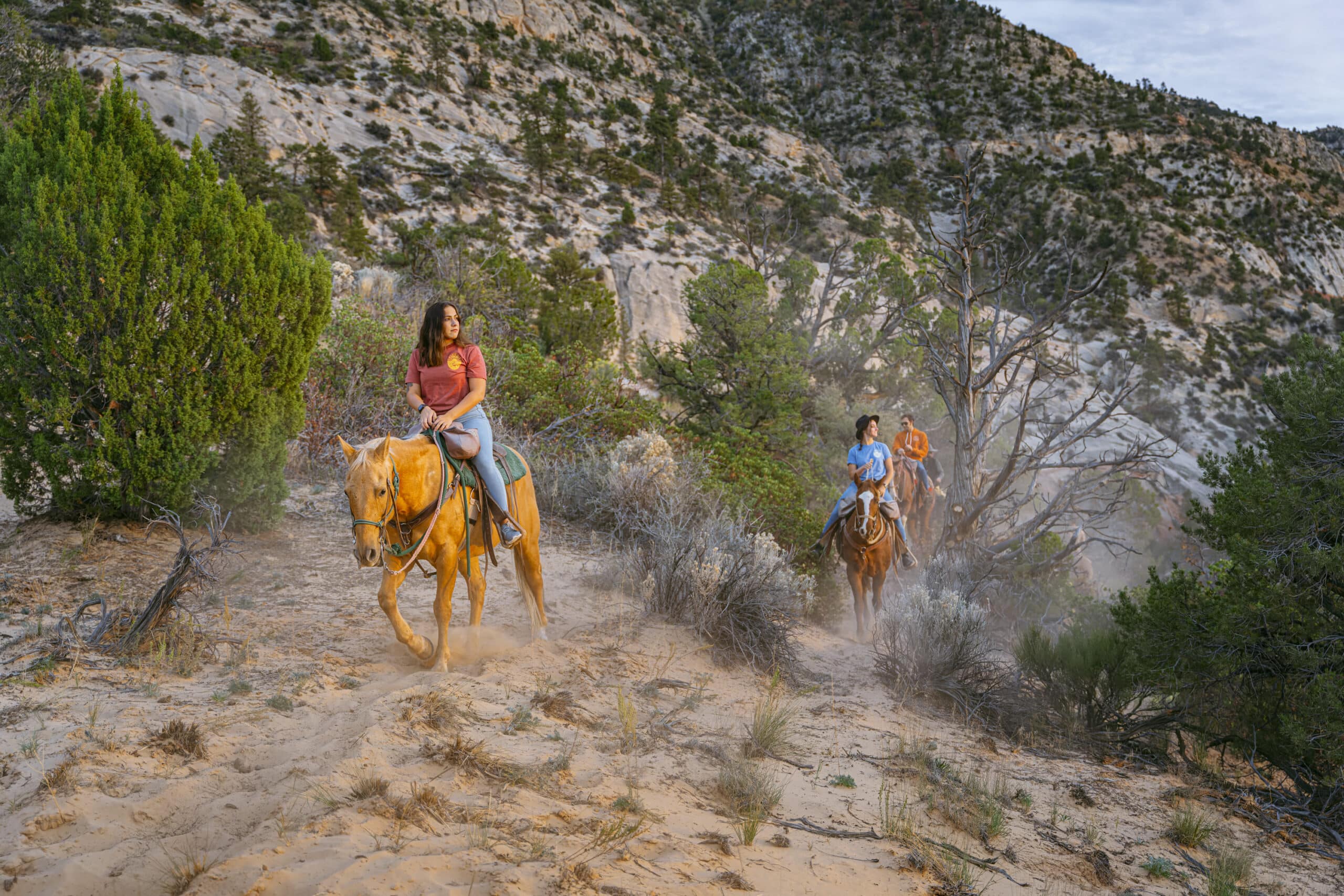 Two people riding horseback