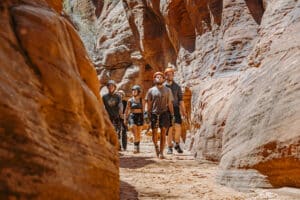 People walking through a canyon in southern Utah
