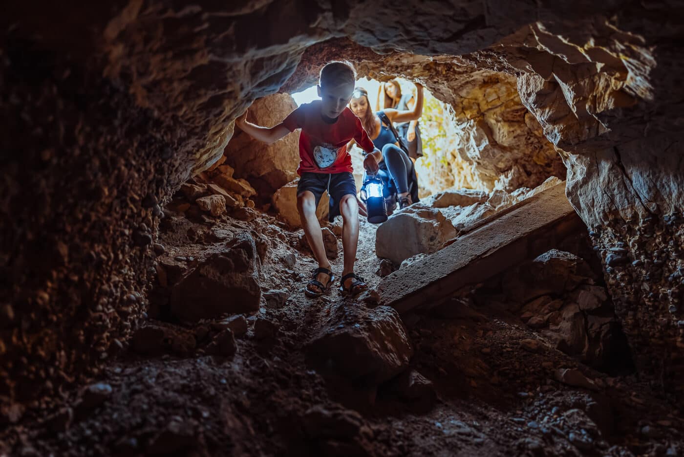Kids exploring a cave near Zion National Park