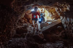 Kids exploring a cave near Zion National Park