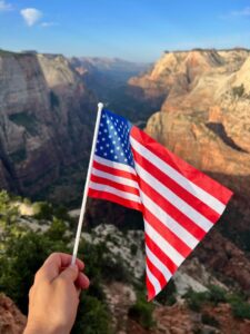 Waving an American flag in Zion National Park
