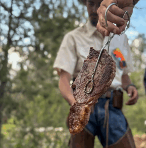 A cowboy and a steak dinner